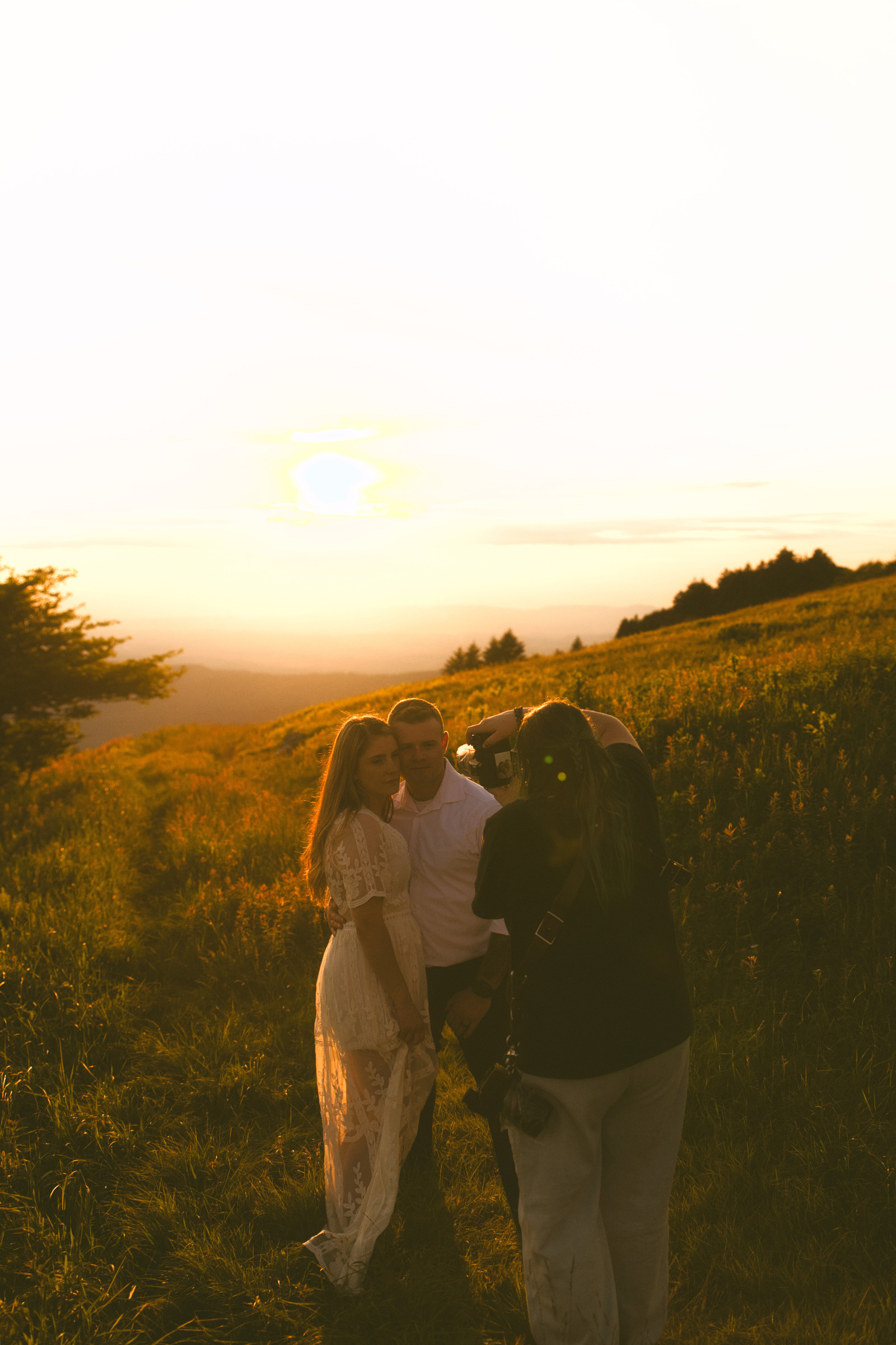 Caledonia the photographer River Songs Photos photographing a couple in a mountain meadow