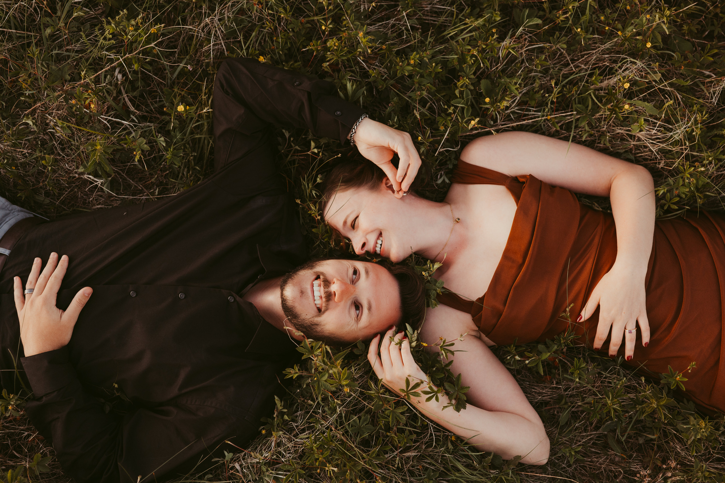 A couple lying together and laughing in mountain grass, Grayson Highlands State Park River Songs Photos